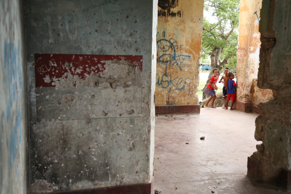 Children playing in an abandoned Indonesian army post